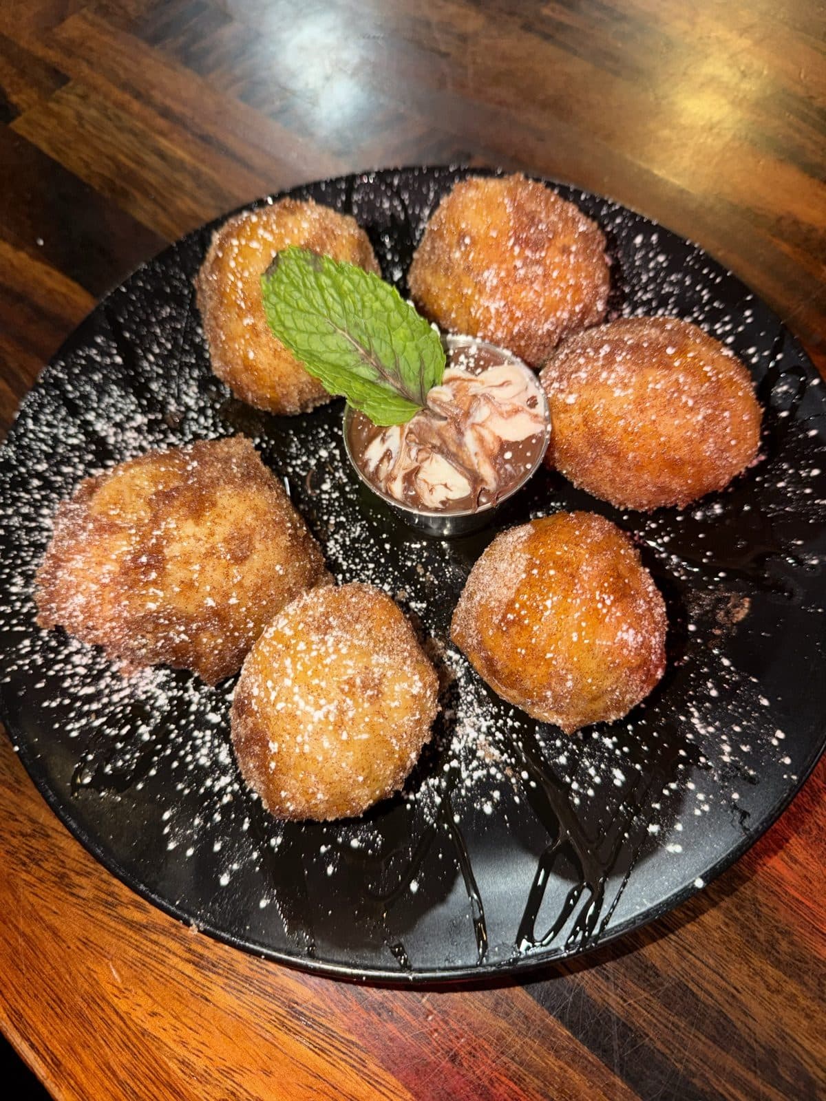 Joey Bag O' Doughnuts — fried pizza dough bites tossed in cinnamon sugar, served with cannoli cream and Nutella
