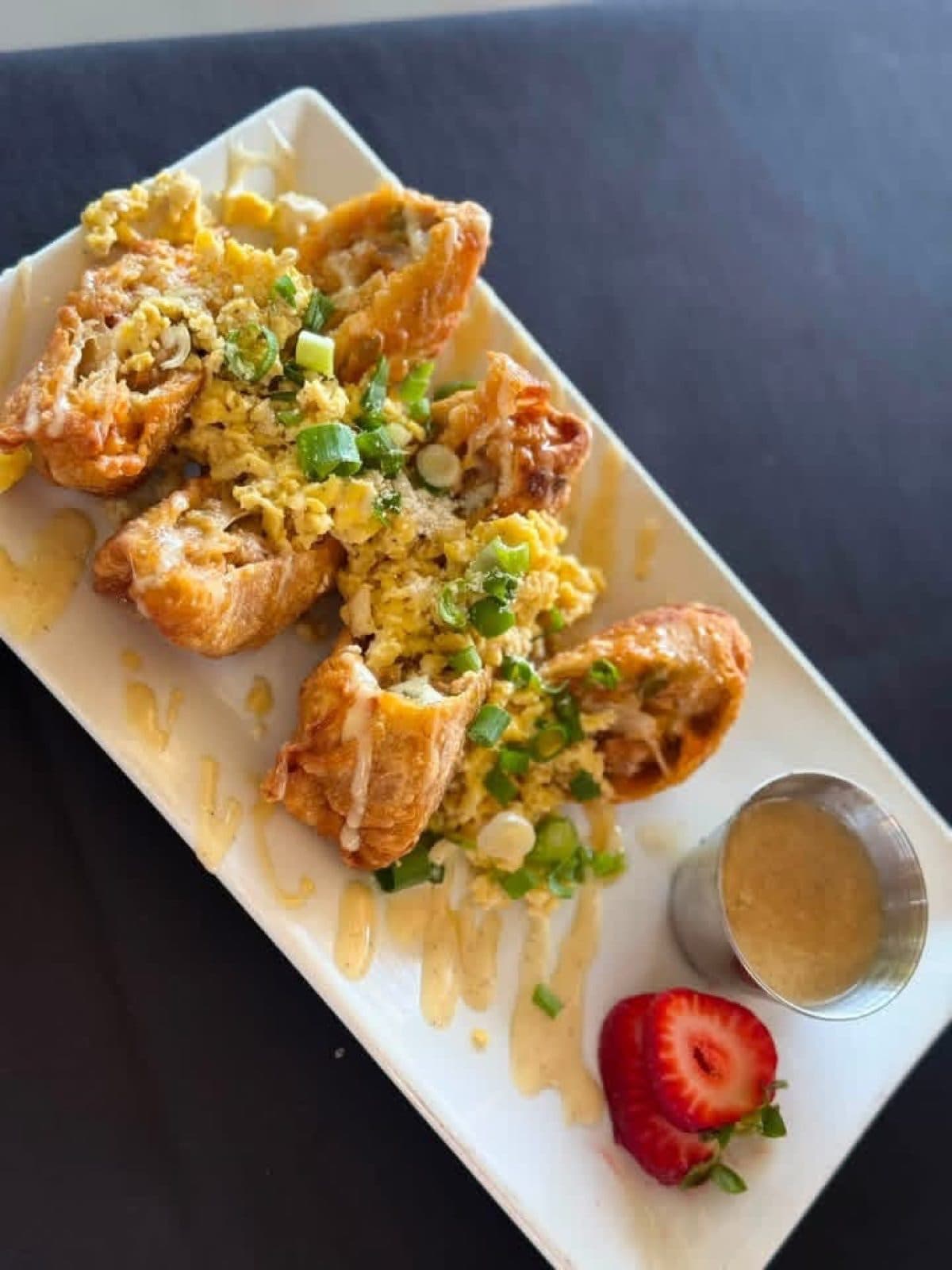 Crispy egg rolls filled with scrambled eggs, Italian sausage, American cheese, sweet peppers and caramelized onions, served with house maple-Dijon aioli