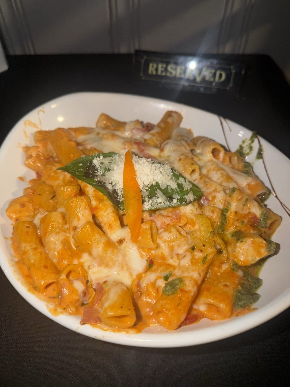 Sunday Riggies — rigatoni in vodka cream sauce with grilled chicken, ham, Genoa salami, roasted red peppers and melted mozzarella